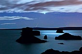 Venus and meteor over reservoir