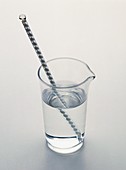 Glass rod refracted in beaker of water