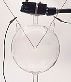 Electrodes igniting light inside glass