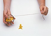 Boy's hands holding gyroscope with string