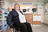 Disabled man in pharmacy