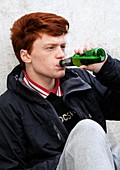 Teenager drinking beer