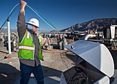 Worker inspecting water pumps