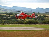 Air ambulance taking off from helipad