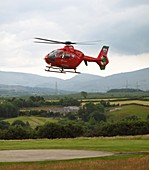Air ambulance taking off from helipad