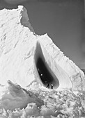 Exploring Antarctic ice grotto,1911