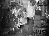 Preparing dog food in Antarctica,1911