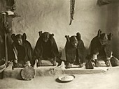 Hopi women grinding grain