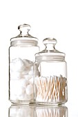 Cotton balls and cotton buds in jars