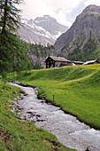 Alpine stream and hut,Switzerland