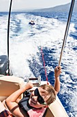 Boy on a speed boat