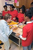 Community volunteers serve food