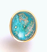 Turquoise stone set in gold ring