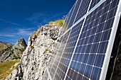 Solar panels attached to a cliff