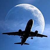 Moon and passenger plane