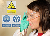 Laboratory worker and warning signs