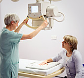 Radiographer preparing a hand X-ray