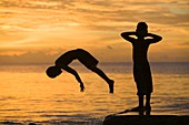 Tuvaluan children leaping into the sea