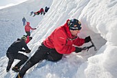 Mountaineers building snow holes