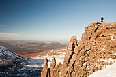 Mountaineer on a rocky granite outcrop