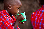 Boy drinking,Tanzania