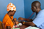 Doctor examining a baby,Sierra Leone