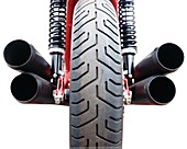 Motorcycle wheel and exhaust pipes