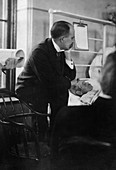 William Osler attending a patient,1900s