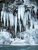 Riverside icicles on canyon wall