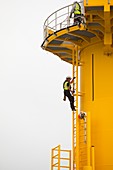 Workers working on a wind turbine