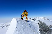 A climber on the summit of Mt Vinson
