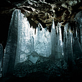View of large ice stalagmites in a cave