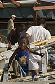 Girl amongst hurricane Katrina wreckage