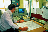 Meteorologist compiling a weather chart