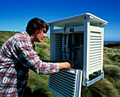 Meteorologist examines weather instruments