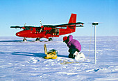 Researcher measures the flow rate of a glacier