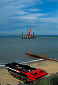 Beach with sea defences being built off-shore