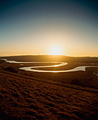 Meanders in a river at sunset