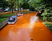 Rusting canal,polluted by iron oxide leachate