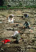 Archaeologists excavate a medieval graveyard