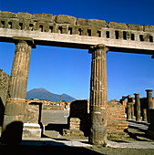 View of Mount Vesuvius through Pompeii ruins