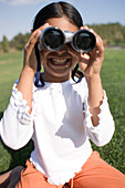 Girl using binoculars