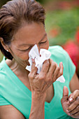 Woman sneezing