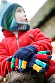 Child wearing gloves