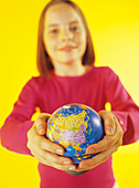 Holding a globe