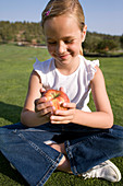 Girl holding an apple