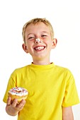 Boy eating a doughnut