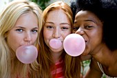 Girls blowing bubblegum