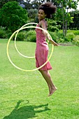 Woman playing with hula hoops