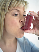 Using asthma inhaler